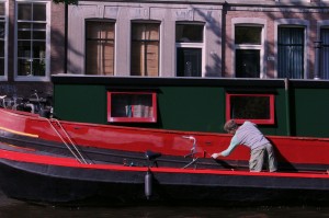 Painting a boat from a boat    